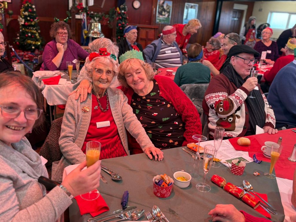 Smiling guests sharing a festive table